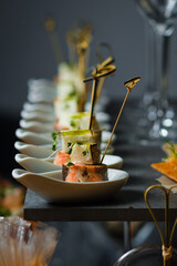 Catering service. Table with snacks food at event.