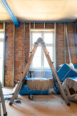 Silver ladder at construction site