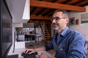 Caucasian spanish enterpreneur happy man portrait working at home office