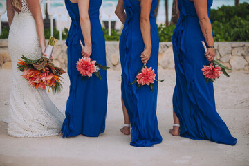 Bridesmaids on the beach wedding, bouquet of pink flowers, beach photos, group photos, wedding party, hugs, girl power, women power, just married