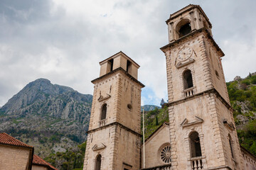 Fototapeta na wymiar The twin towers of St. Tryphon's Cathedral (Katedrala Sv Tripuna) in the eponymous square (Trg Sv Tripuna), Kotor, Montenegro