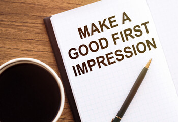 MAKE A GOOD FIRST IMPRESSION - text on notepad on wooden desk.