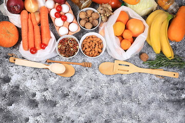 Healthy natural diet food in eco-bags and cans. Selection of fresh fruits and vegetables with vitamin C for strengthening the immune system and losing weight, zero waste concept, food delivery,