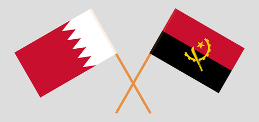 Crossed flags of Bahrain and Angola. Official colors. Correct proportion