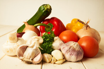 Variation of fresh and tasty vegetables on wooden table for dinner 