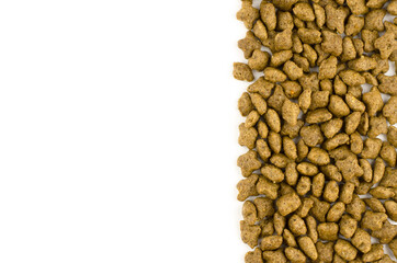 Dry cat food on white background with place for text