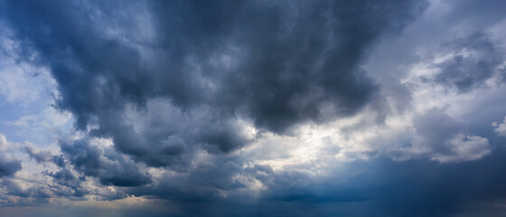 Fototapeta premium Stormy sky with dark rainy clouds. Weather forecast concept.