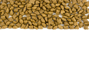 Dry cat food on white background with place for text
