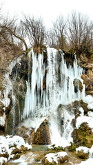 Frozen waterfall in the mountain Zlatibor in Serbia. Waterfall in winter season.