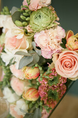 Close up Wedding bouquet on a glass mirror table. Blur and selective focus. 