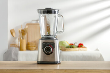 Blender on the kitchen table in the sunshine of spring 