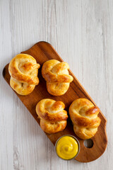 Homemade Basic Soft Pretzels with Mustard, top view. Flat lay, overhead, from above. Copy space.