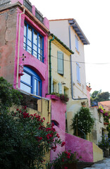 Fototapeta na wymiar Pink colored houses in france