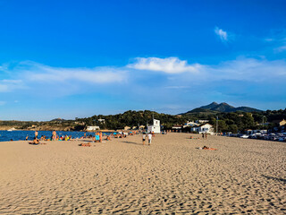 beach with umbrellas and chairs