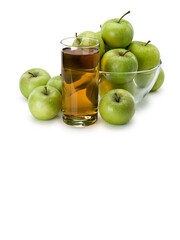 Apple juice and fruits of green apples in glassware