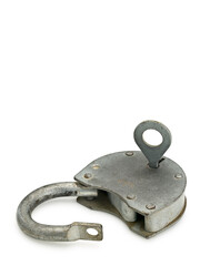 opened hinged lock with key lying on table