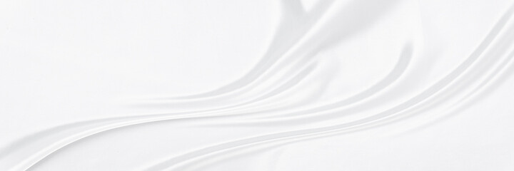 White gray satin texture that is white silver fabric silk panorama background with beautiful soft blur pattern natural.