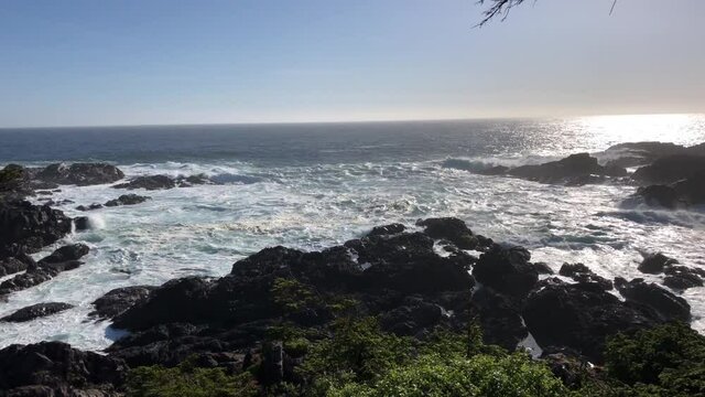 Waves of Pacific Ocean hitting shores near Pacific Rim National Park Reserve - popular surfing destination located between Tofino and Ucluelet on the west side of Vancouver Island 
