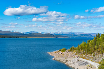 Tjaktjajavrre, lake in Sweidish Lapland on a beautiful day of arctic summer. Mountains of Sarek...