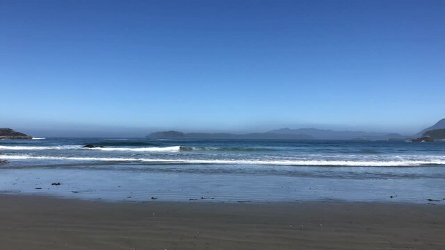 Waves of Pacific Ocean hitting shores near Pacific Rim National Park Reserve - popular surfing destination located between Tofino and Ucluelet on the west side of Vancouver Island 