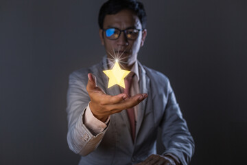One star motion over a businessman's hand. Positive thinking, The concept of a positive rating. business concepts.