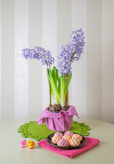 Spring Easter still life with hyacinths, chickens and meringues