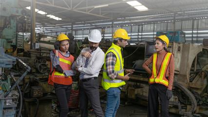 Group of factory workers or engineers express a great happiness after big business success or achievements