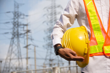 Technician holding Yellow hat safety hard hat sunlight background