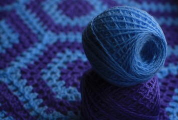 Plaid crocheted from blue and lilac threads