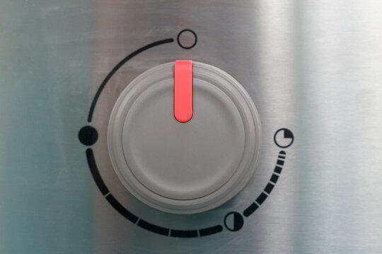 Round knob for setting parameters. Red pointer. Metallic luster.