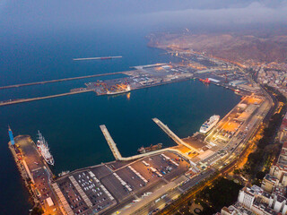 Obraz premium Aerial view of old town and port in Almeria city with of sailboats and yachts