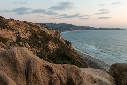 View of La Jolla San Diego from Gliderport cliffs at UCSD during sunset overlooking the beach and pacific ocean