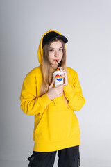 Woman with LGBT rainbow coffee cup