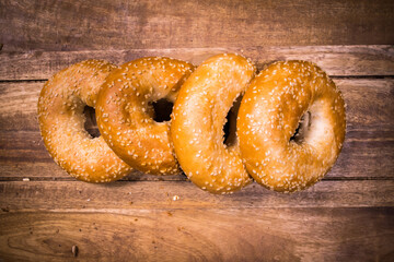 Freshly baked bagels on a wooden table - food photography