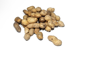 a pile of peanuts in a shell on a white background