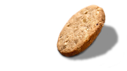Wholegrain oatmeal biscuit on white background with copy space.