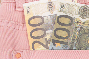 Obraz premium Money in pocket of pants. Finance and banking