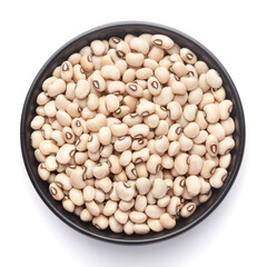 macro Close-up of Organic soybean,  (Glycine max ) or soya bean dal on a ceramic black bowl. Top view 