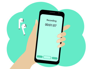 Hand with a mobile phone. The phone is recording a voice message