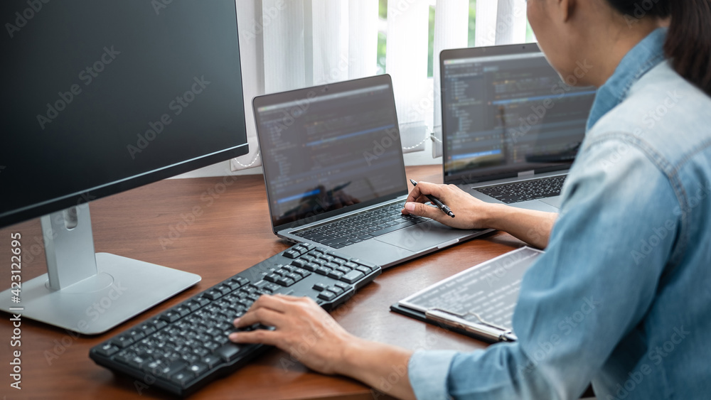Aufkleber asian programmer woman holding pen and writing code with data website or data applications