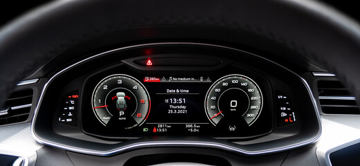 Close up shot of a fully digital speedometer in a car. Car digital dashboard. Dashboard details...