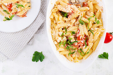 Fetapasta. Trending Feta bake pasta recipe made of cherry tomatoes, feta cheese, garlic and herbs.  Top view, above, copy space.