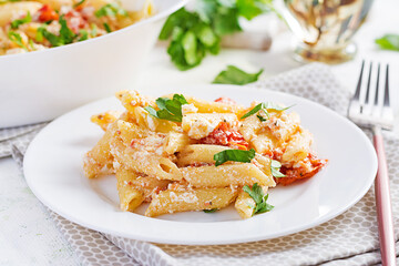 Fetapasta. Trending Feta bake pasta recipe made of cherry tomatoes, feta cheese, garlic and herbs.