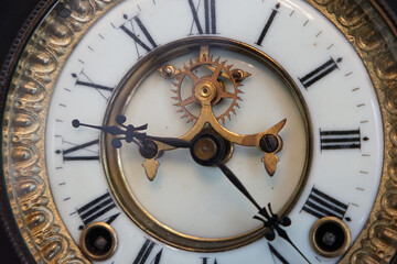 Fototapeta na wymiar The dial of an old clock in the room