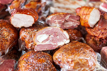 Market, meat counter, smoked lamb meat, horse sausage, ham