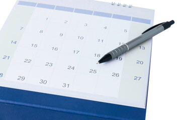 Close up pen on calendar page to mark the date planning concept