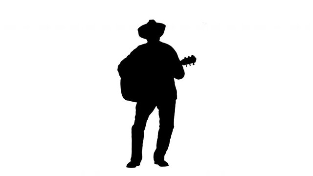 Silhouette Senior man in a patterned shirt singing and playing guitar.