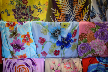 Selection of Malaysia batik in silk fabric on display in Pasar Payang, Kuala Terengganu, Malaysia.