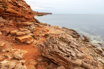 Fototapeta na wymiar Rocky coast of the ancient sea, chalk deposits