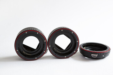 Macro rings for camera lens close-up on a gray background. Professional macro photography,...